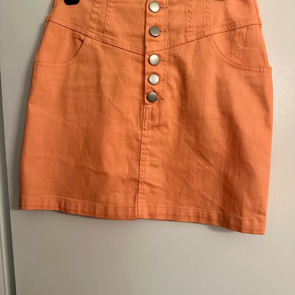 Orange ( coral) skirt; 16”. 5 button detail on front